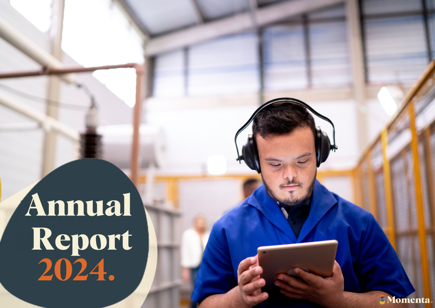 A young man with earmuffs on looks at a tablet in an industrial looking workplace. Text reads Annual Report 2024